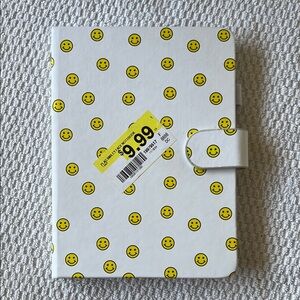 White Notebook with Yellow Smiley Faces